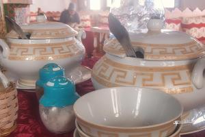 a group of vases and bowls on a table at Hotel Madrid in Chefchaouene