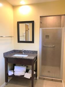 a bathroom with a sink and a shower at Bestway Inn in Grants Pass