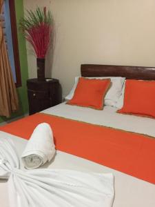 Postel nebo postele na pokoji v ubytování ApartaHotel Tierras Amazonicas