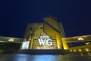 a building with a sign on the front of it at night at Hotel Water Gate Hamamatsu (Adult Only) in Hamamatsu