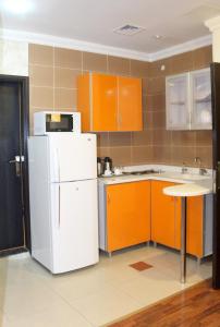 A kitchen or kitchenette at Raoum Inn