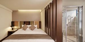 Postel nebo postele na pokoji v ubytování Hotel Sukimi + 35 fotografií