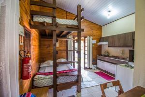 a room with two bunk beds in a kitchen at Green Mountain Pousada in Florianópolis +25 photos