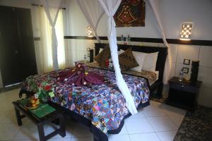 Postel nebo postele na pokoji v ubytování Putu Guest House Pemuteran