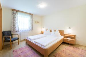 Postel nebo postele na pokoji v ubytování 4 Mountains Apartments