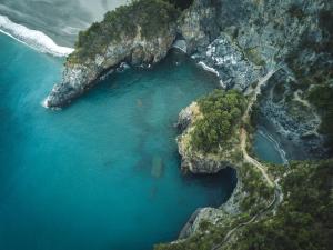 an aerial view of a body of water on a cliff at Villa Crawford in San Nicola Arcella