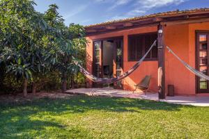 a hammock in front of a house at Green Mountain Pousada in Florianópolis