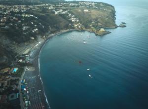 an aerial view of a beach with boats in the water at Villa Crawford in San Nicola Arcella