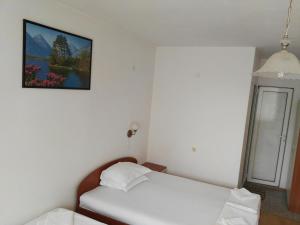 A bed or beds in a room at Villa Diana Self check-in
