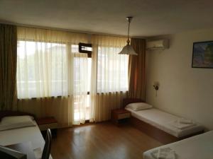 A bed or beds in a room at Villa Diana Self check-in