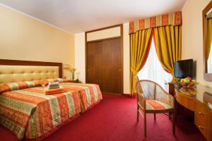 מיטה או מיטות בחדר ב-Hotel Metropole