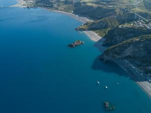 an aerial view of a bay with boats in the water at Villa Crawford in San Nicola Arcella