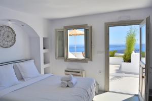 Postel nebo postele na pokoji v ubytování Cocoon Suites + 37 fotografií
