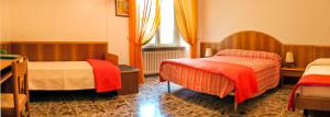 Postel nebo postele na pokoji v ubytování B&B Il Colle