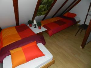 מיטה או מיטות בחדר ב-Ferienhaus Erica
