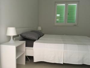 Postel nebo postele na pokoji v ubytování Villa Kvarner