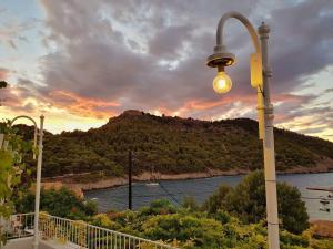 a street light with a view of a river at Vassilis Retreat in Asos