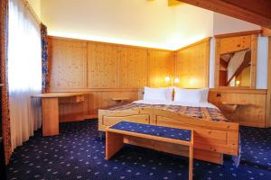 Postel nebo postele na pokoji v ubytování Hotel Alpi