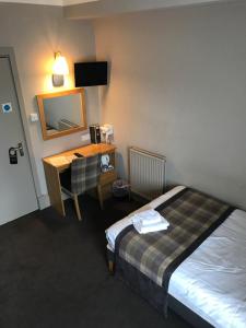 Postel nebo postele na pokoji v ubytování Buchan Hotel