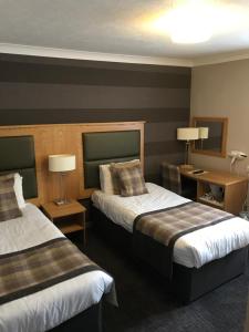 Postel nebo postele na pokoji v ubytování Buchan Hotel