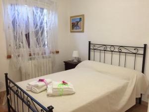 Postel nebo postele na pokoji v ubytování Agriturismo Podere Valdo