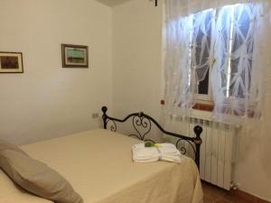 Postel nebo postele na pokoji v ubytování Agriturismo Podere Valdo