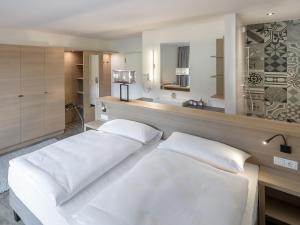 Ein Bett oder Betten in einem Zimmer der Unterkunft Hotel Matteo