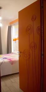Postel nebo postele na pokoji v ubytování B&B L'Arcobaleno