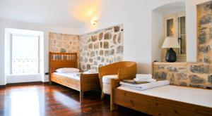 Llit o llits en una habitació de Beachfront Villa Perast