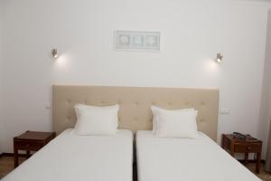 Postel nebo postele na pokoji v ubytování Hotel S. Jorge