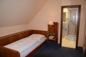 Postel nebo postele na pokoji v ubytování Hotel Grüner Baum