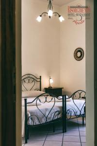Postel nebo postele na pokoji v ubytování Hotel Risorgimento