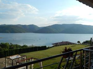 a view of a large body of water with mountains at Villa Irina in Kŭrdzhali +13 photos
