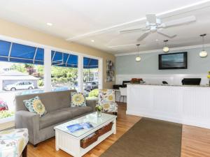 a living room with a couch and a table at Cape Colony Inn in Provincetown