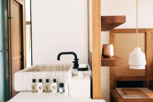 Cama ou camas em um quarto em Branco Mykonos
