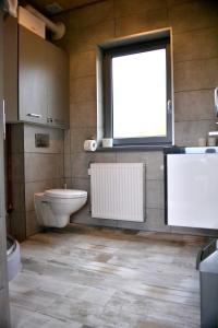 Kúpeľňa v ubytovaní Magnolia Pokoje Gościnne