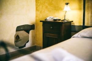Postel nebo postele na pokoji v ubytování Hotel Risorgimento