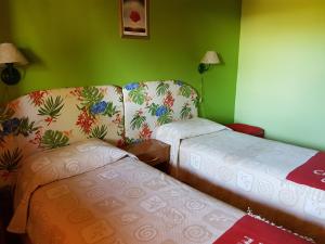 Cama ou camas em um quarto em Cabañas Normana Inn