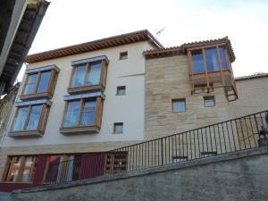 a building with windows on the side of it at Los Calaos de Briones in Briones