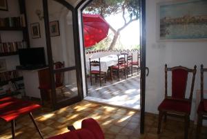 a view of a dining room with a table and chairs at Villa Punta in Okrug Donji
