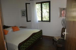 a bedroom with a bed and a window at Villa Punta in Okrug Donji
