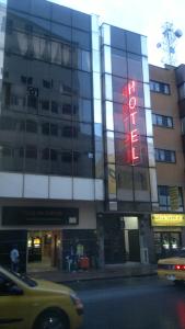 a building with a neon sign on the side of it at Hotel Vermon Armenia in Armenia