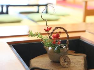 Postel nebo postele na pokoji v ubytování Shirafune Grand Hotel