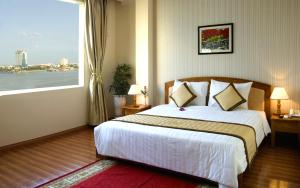 Cama o camas de una habitación en Bamboo Green Hotel
