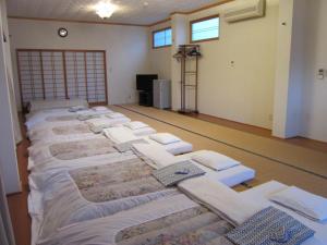 Postel nebo postele na pokoji v ubytování Ryokan Matsukaze