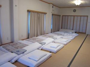 Postel nebo postele na pokoji v ubytování Ryokan Matsukaze