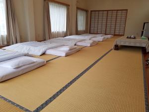 Postel nebo postele na pokoji v ubytování Ryokan Matsukaze