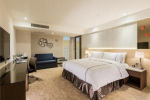 Postel nebo postele na pokoji v ubytování K Hotel Tianjin