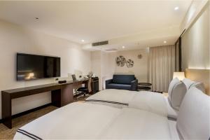 Postel nebo postele na pokoji v ubytování K Hotel Tianjin