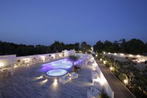 an image of a swimming pool at night at Garden Hotel Ripa in Vieste